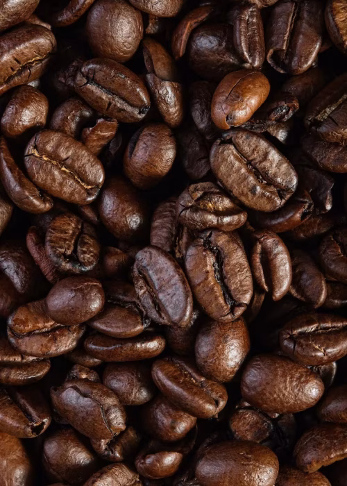top-view-texture-roasted-readytodrink-coffee-scene-coffee-beans-black-ground-coffee_166373-2288